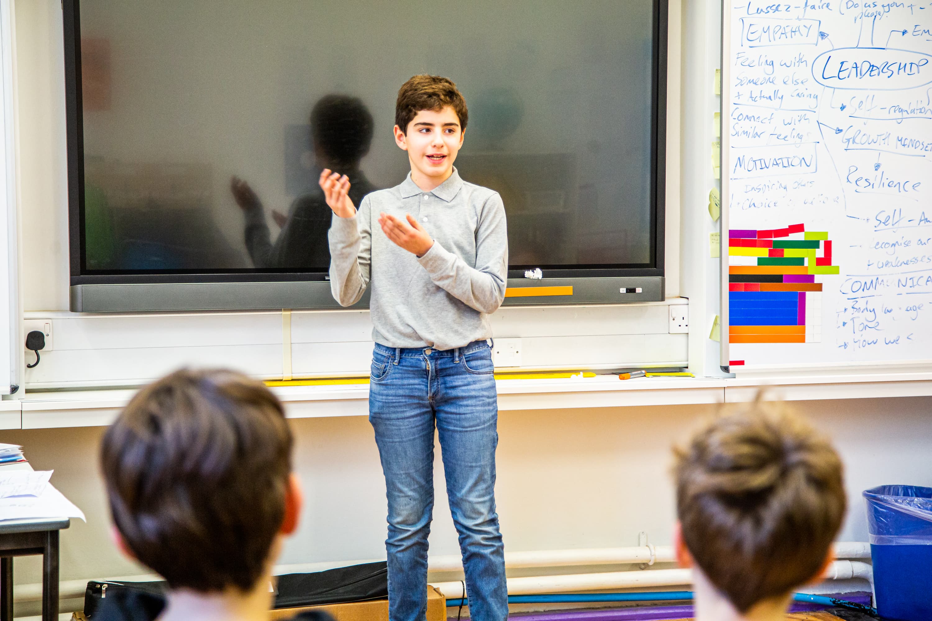 Boy presents to class.