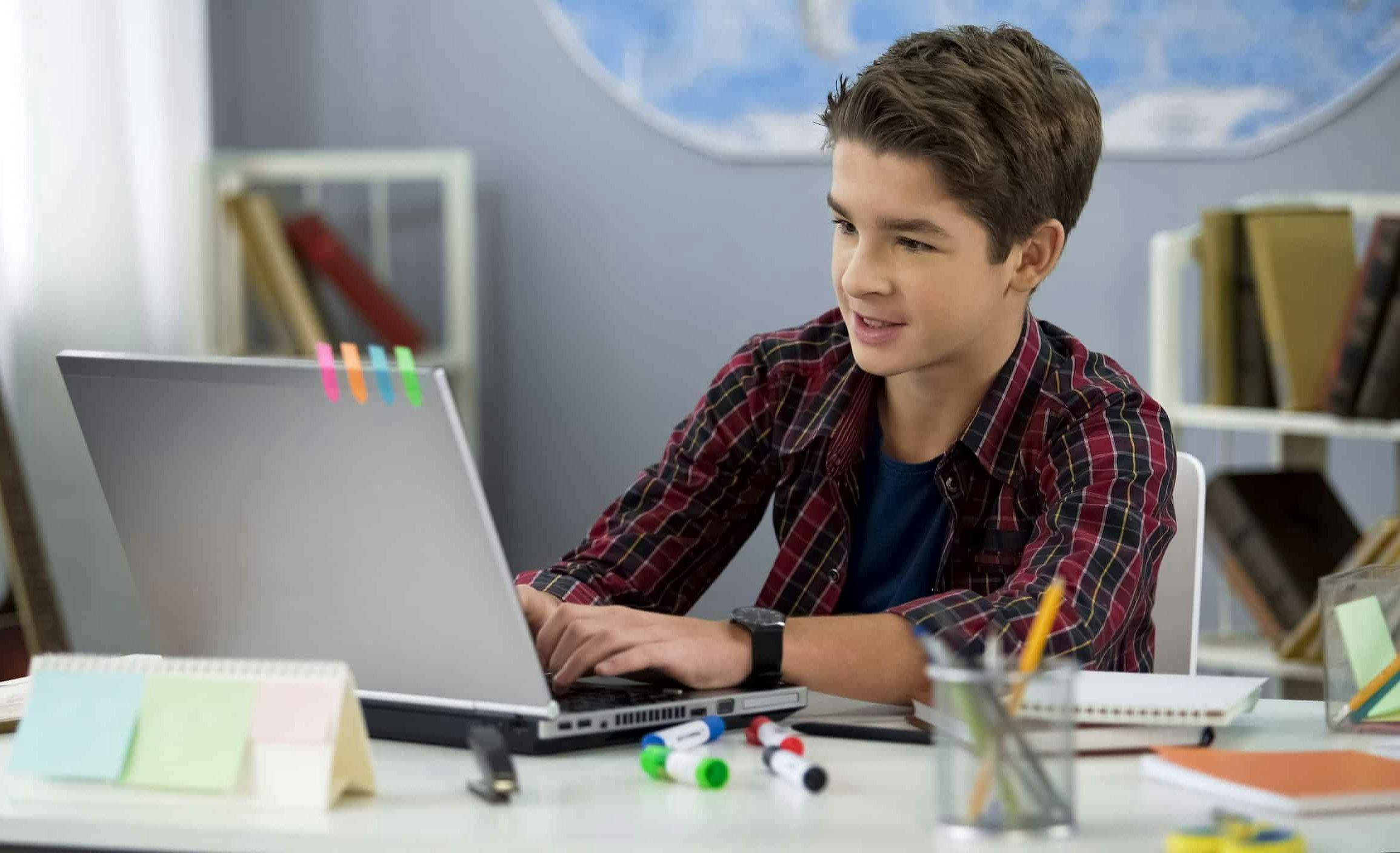 Boy using computer.