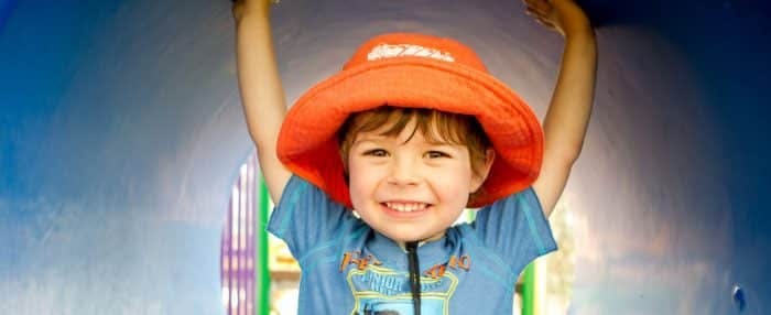 happy kid in an orange hat
